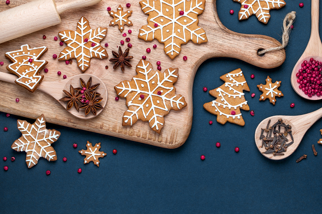 A wooden board with star-shaped cookies on them