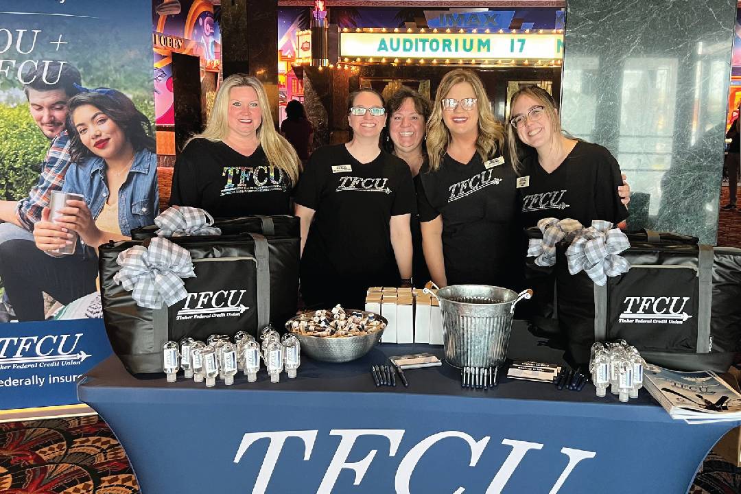 Group of TFCU employees in front of table