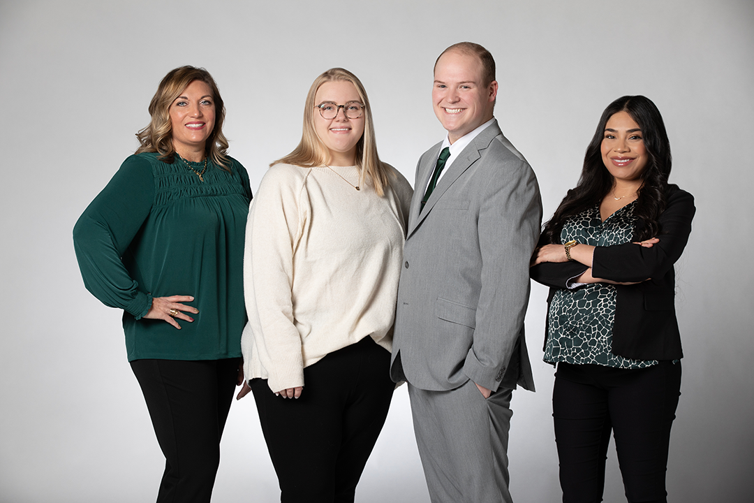 The TFCU Member Solutions team (Amber Tate, Megan Scott, Dylan Rogers, Mayra Torres) standing together posing