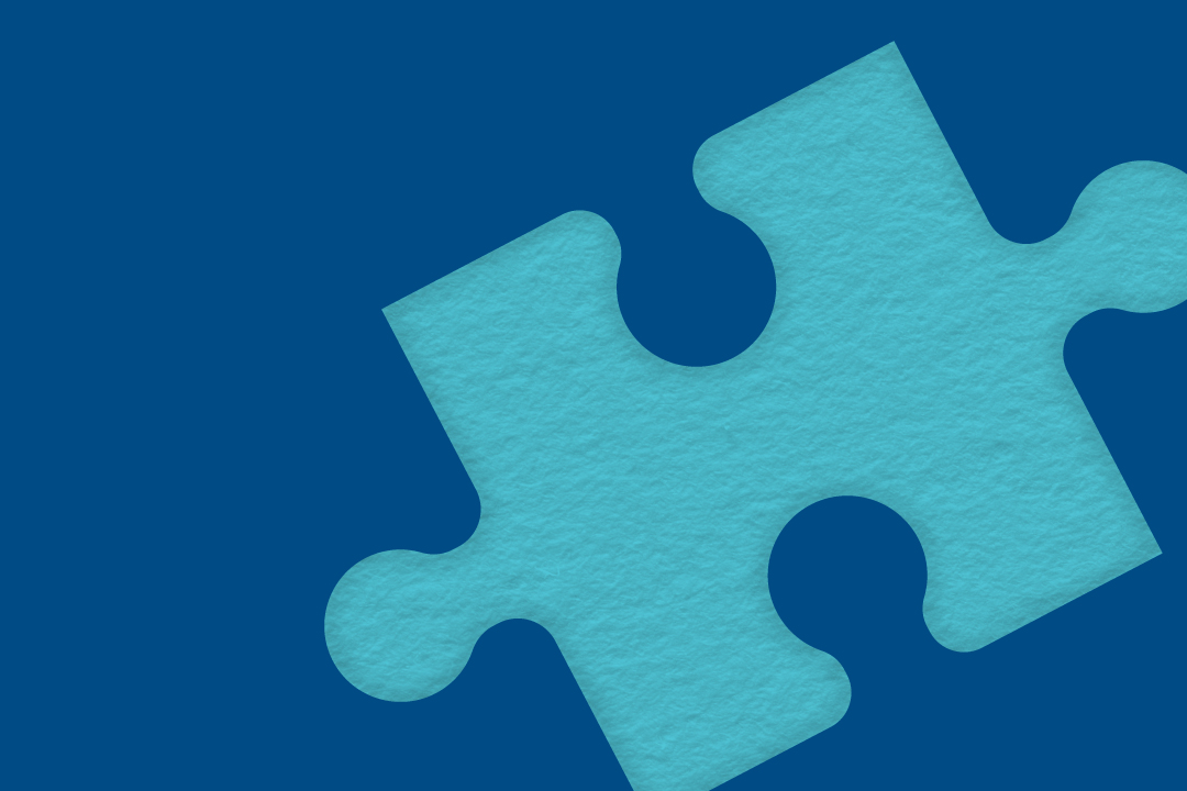 Teal puzzle piece on a navy background