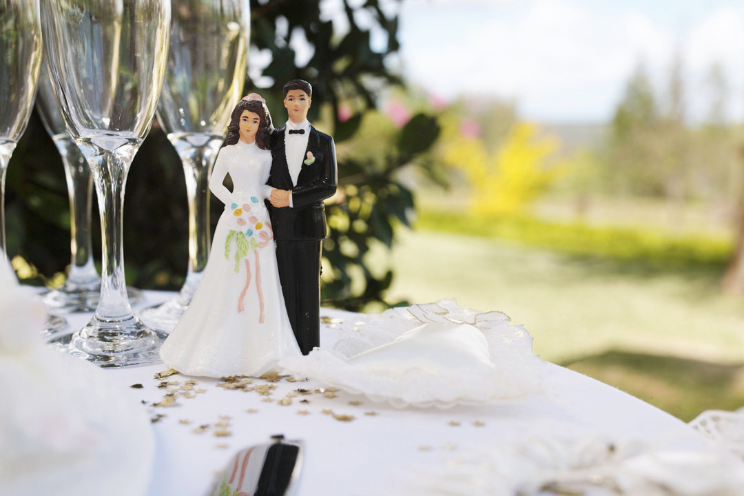 Bride and groom figurine on table by champagne flutes : Stock Photo View similar imagesMore from this photographer Bride and groom figurine on table by champagne flutes