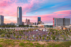 Drone shot of the scissortail park with a crowd of people.