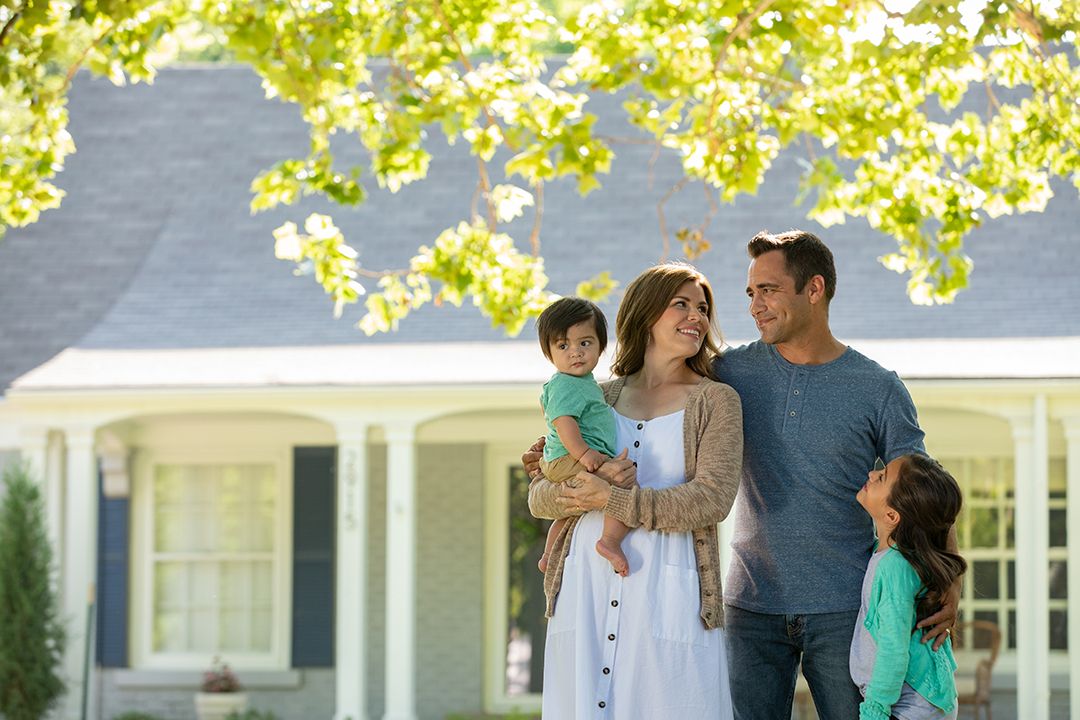 Family in front of a house