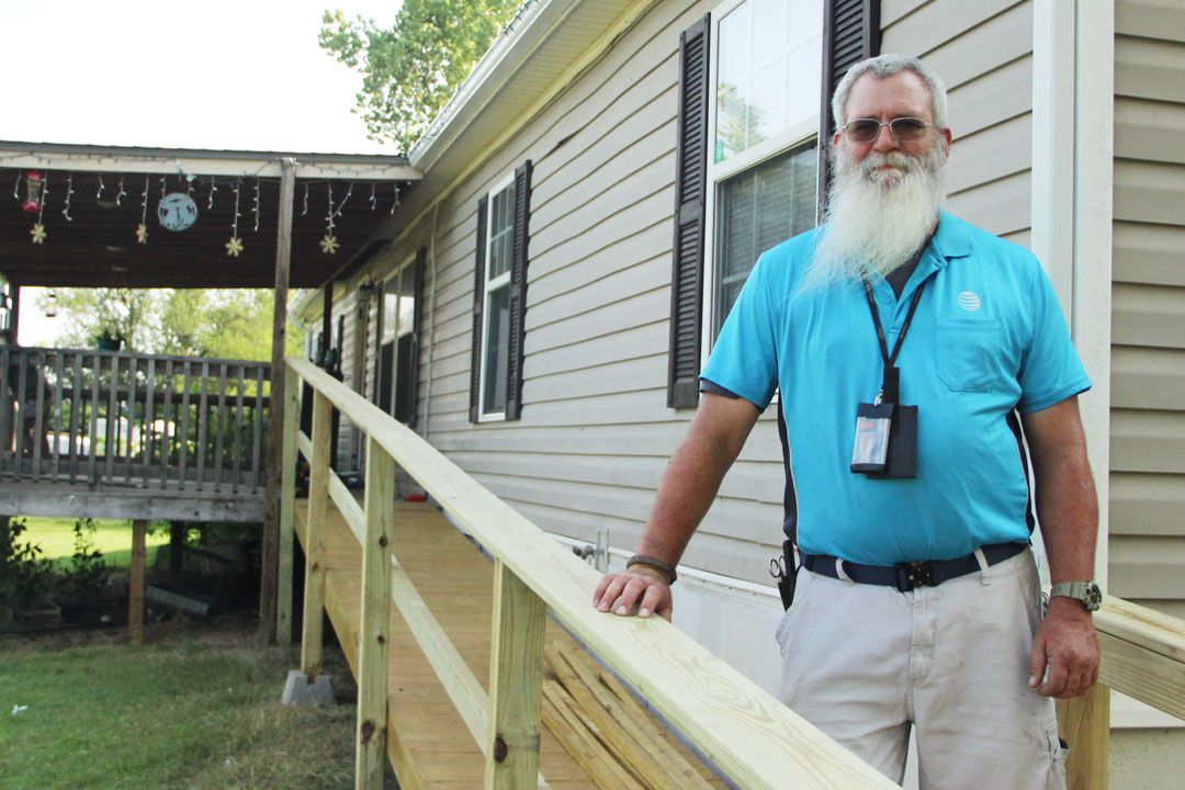 A man standing in front of a house