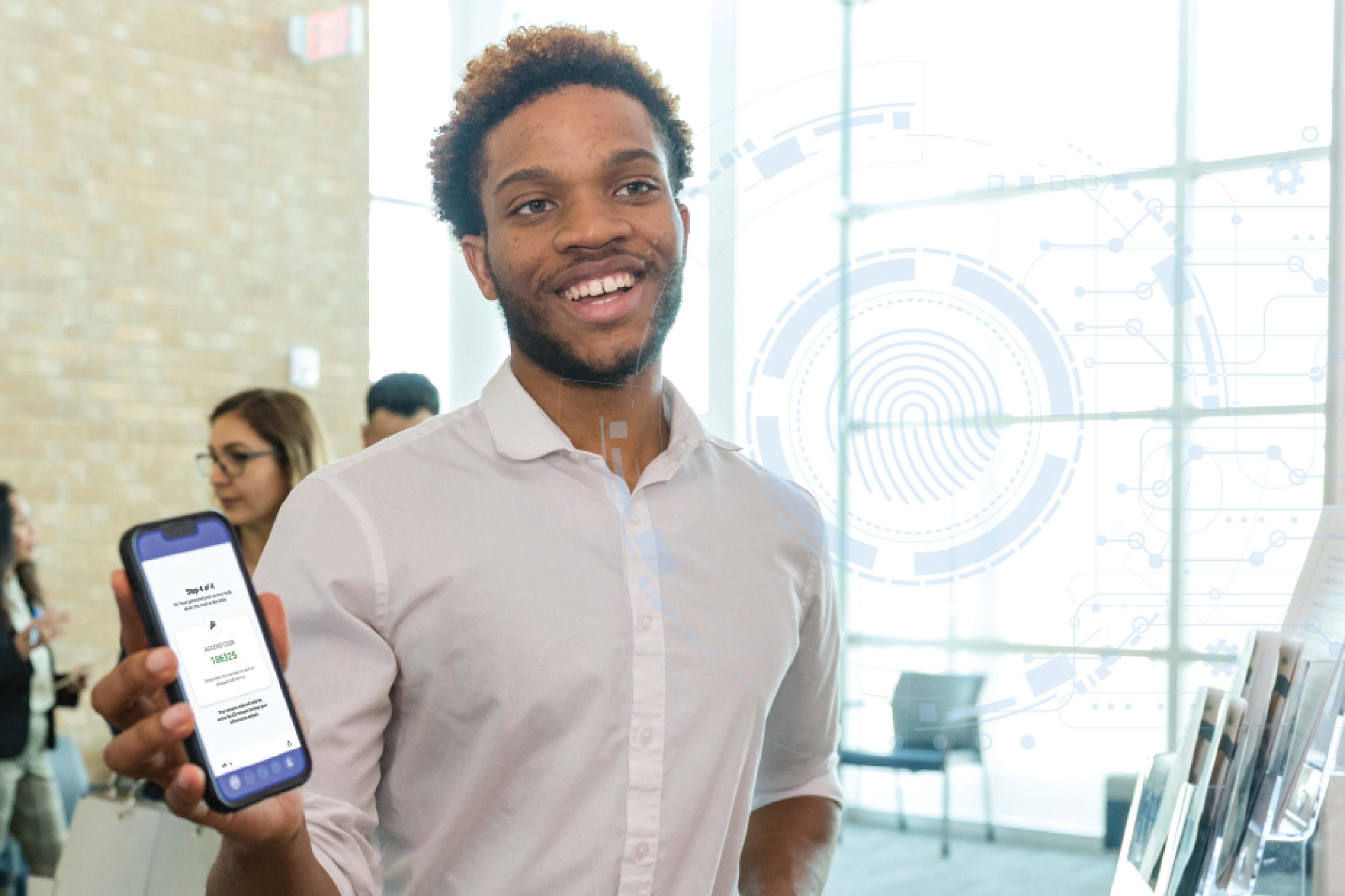 A man holding up a mobile device to the camera