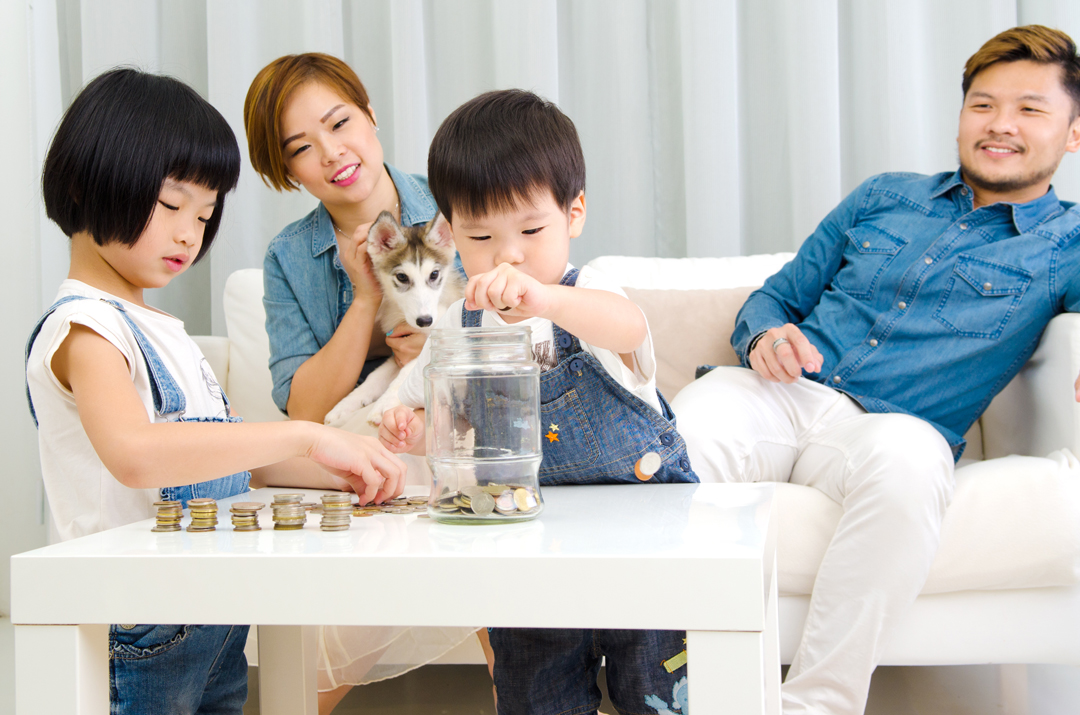 Asian family teaching about savings