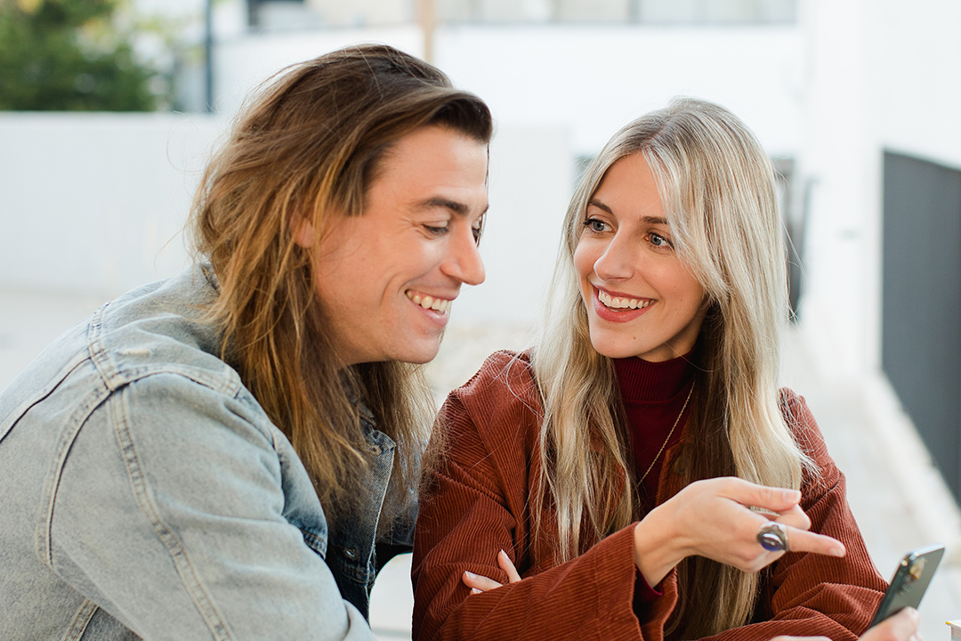 Young couple looking at a mobile device